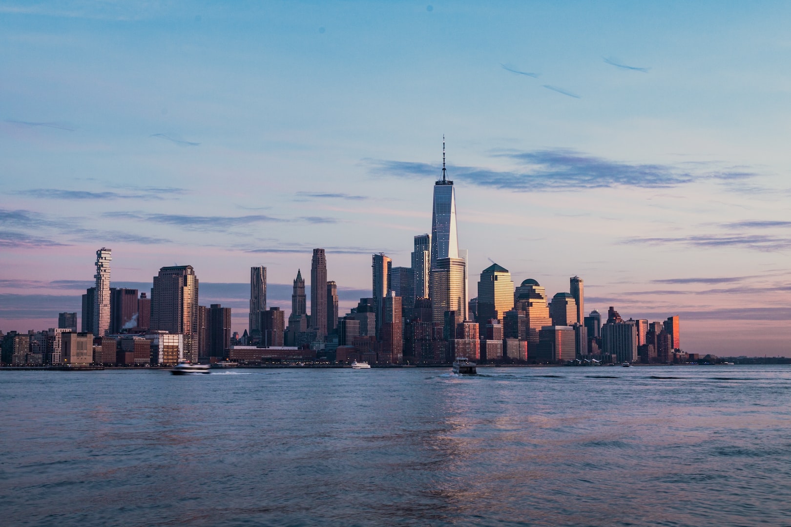 View of the World Trade Center and lower Manhattan, synonymous with economic prowess, resilience and American identity. EB 5 is a gateway for many investors to be a part of American identity by investment.